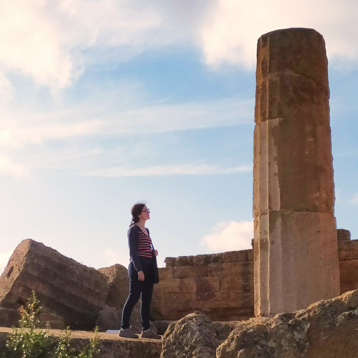 Anne-Sophie standing and looking at Roman ruins in Sicily. Supposed to be funny because the website is in construction. Hahaha.